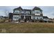 Charming two-story home with brick and siding exterior, covered porch, and manicured lawn at 12889 Girvan Way, Fishers, IN 46037