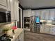 Kitchen featuring stainless steel appliances, granite countertops, and white cabinets at 12889 Girvan Way, Fishers, IN 46037
