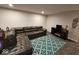Cozy living area featuring a comfortable sectional sofa, a TV stand, and a decorative rug at 12889 Girvan Way, Fishers, IN 46037