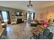 Inviting living room features a fireplace, decorative shelves, and a view of a Christmas tree at 12889 Girvan Way, Fishers, IN 46037