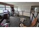 Upstairs loft area with an exposed brick wall, work space, and access to additional rooms at 12889 Girvan Way, Fishers, IN 46037