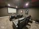 Home theater with plush seating, large screen, and ambient lighting at 12889 Girvan Way, Fishers, IN 46037