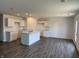 Spacious kitchen with a center island, white cabinets, and plenty of room for dining at 1414 Bluebonnet Pl, Shelbyville, IN 46176