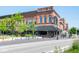 Capone's restaurant is situated on a bricked city street with outdoor seating and a stylish black awning at 1414 Bluebonnet Pl, Shelbyville, IN 46176