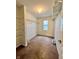 Walk-in closet with carpet, shelving and a window that provides natural light at 1427 Broyles Ln, Indianapolis, IN 46231