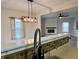 View of the open concept floor plan from the kitchen into the living room with a fireplace at 1427 Broyles Ln, Indianapolis, IN 46231