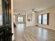 Bright, spacious living room with vinyl floors, recessed lights, and abundant natural light at 1427 Broyles Ln, Indianapolis, IN 46231