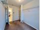 Spacious walk-in closet with adjustable shelving and neutral carpeting, offering ample storage space at 1427 Broyles Ln, Indianapolis, IN 46231