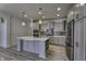 Modern kitchen featuring an island with pendant lighting and stainless steel appliances at 16822 Imperial Ct, Fishers, IN 46040