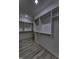 Walk-in closet with wood floors, white walls, base trim, shelving, and rack at 16822 Imperial Ct, Fishers, IN 46040