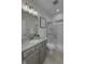This bathroom features a glass shower door, patterned granite counters, and stainless steel fixtures at 16822 Imperial Ct, Fishers, IN 46040