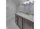 Charming bathroom showcasing a granite countertop, tiled floor and modern fixtures at 16822 Imperial Ct, Fishers, IN 46040