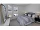Charming bedroom with a large bed, side tables, and large bay windows at 16822 Imperial Ct, Fishers, IN 46040