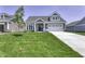 Charming two-story home featuring a well-manicured lawn, stone accents and attached two-car garage at 16822 Imperial Ct, Fishers, IN 46040