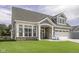 Charming home featuring a well-manicured lawn, stone accents and attached two-car garage at 16822 Imperial Ct, Fishers, IN 46040