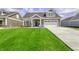 Inviting home with a manicured lawn and attached two-car garage at 16822 Imperial Ct, Fishers, IN 46040
