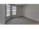 Cozy bedroom with neutral carpet and windows overlooking the exterior at 16822 Imperial Ct, Fishers, IN 46040