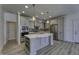Modern kitchen with grey cabinets, stainless steel appliances, and a large island at 16822 Imperial Ct, Fishers, IN 46040