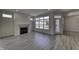Open living area with neutral walls, fireplace and rear access at 16822 Imperial Ct, Fishers, IN 46040