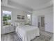 Bright main bedroom featuring two windows, a large rug, and an ensuite bath at 16822 Imperial Ct, Fishers, IN 46040