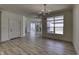 Open-concept living room with light wood floors and large windows for natural light at 16822 Imperial Ct, Fishers, IN 46040