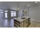 Stylish kitchen island with a sink and dishwasher, plus pendant lights and open layout at 16822 Imperial Ct, Fishers, IN 46040