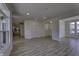 Open-concept living room with archways and large windows letting in natural light at 16822 Imperial Ct, Fishers, IN 46040