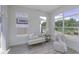Bright sun room with large windows offering views of the backyard and comfortable seating at 16822 Imperial Ct, Fishers, IN 46040