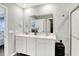 Bathroom with double sink vanity, stylish mirror, and a walk-in shower at 1835 Fairmount Dr, Greenfield, IN 46140