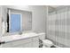 Bright bathroom featuring a single vanity, a well-lit mirror, and a shower with a curtain at 1835 Fairmount Dr, Greenfield, IN 46140