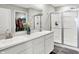 Modern bathroom featuring a double vanity, walk-in shower, and well-organized closet space at 1835 Fairmount Dr, Greenfield, IN 46140