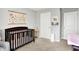 Peaceful Bedroom with crib, and white doors at 1835 Fairmount Dr, Greenfield, IN 46140