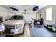 Organized garage featuring a parked car, exercise equipment, and ample storage space for various needs at 1835 Fairmount Dr, Greenfield, IN 46140