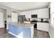 Spacious kitchen with white cabinets, stainless steel appliances, and a center island with granite countertops at 1835 Fairmount Dr, Greenfield, IN 46140