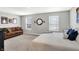 Spacious main bedroom with a neutral color palette, two windows, and ample space for a sitting area at 1835 Fairmount Dr, Greenfield, IN 46140