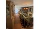 Formal dining room with a large china cabinet, decorative rug, and glass table at 2130 Theobald St, Shelbyville, IN 46176