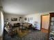 Cozy living room with decorative furniture and ample natural light, perfect for relaxing and entertaining guests at 2130 Theobald St, Shelbyville, IN 46176