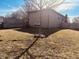 Spacious backyard featuring a tree, a wooden fence, and some small garden decorations at 2317 Lincoln Dr, Cicero, IN 46034
