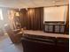 Finished basement area with drop ceiling, home theater screen, accent lighting, and comfortable seating at 2317 Lincoln Dr, Cicero, IN 46034