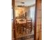Inviting dining room featuring a wooden table, chairs, ceiling fan, and patterned curtains for a bright aesthetic at 2317 Lincoln Dr, Cicero, IN 46034