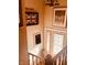 The entryway is brightly lit and adorned with unique artwork and an umbrella stand at 2317 Lincoln Dr, Cicero, IN 46034