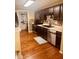 Modern kitchen features stainless steel appliances, dark wood cabinets, tile backsplash, and wood flooring at 2317 Lincoln Dr, Cicero, IN 46034