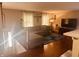 Sunlit living room boasting hardwood floors and comfortable, oversized seating at 2317 Lincoln Dr, Cicero, IN 46034