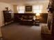 Cozy living room with decorative brick fireplace, wood paneling, and carpeted floor at 2317 Lincoln Dr, Cicero, IN 46034