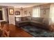 Cozy living room features hardwood floors and a comfortable sectional sofa at 2317 Lincoln Dr, Cicero, IN 46034