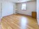Bedroom featuring neutral walls, hardwood floors, and a large window at 2613 E 7Th St, Anderson, IN 46012