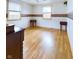 Bedroom with two windows, decorative border, wood-look floor and antique side tables at 2613 E 7Th St, Anderson, IN 46012