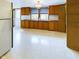 Additional kitchen with wooden cabinets, granite countertops, and stainless steel appliances at 2613 E 7Th St, Anderson, IN 46012
