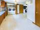 Convenient laundry room with washer, dryer, and wooden folding door at 2613 E 7Th St, Anderson, IN 46012