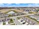 Expansive aerial view reveals new townhomes in a burgeoning community with scenic pond at 2792 Maricopa Blvd, Whitestown, IN 46075